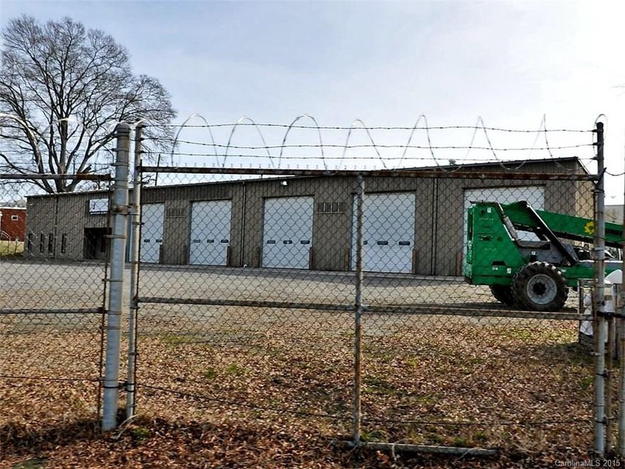 SouthEnd Redevelopment Site—Diesel mechanic facility with 5 over sized bays, 4 offices, break room, locker room and conference room.  Fully fenced perimeter with razor wire.  Ideal for high visibility retail, automotive, or retro-fit.  1.14 acres, Zoned I-2, Approximately 11,000 sq. ft