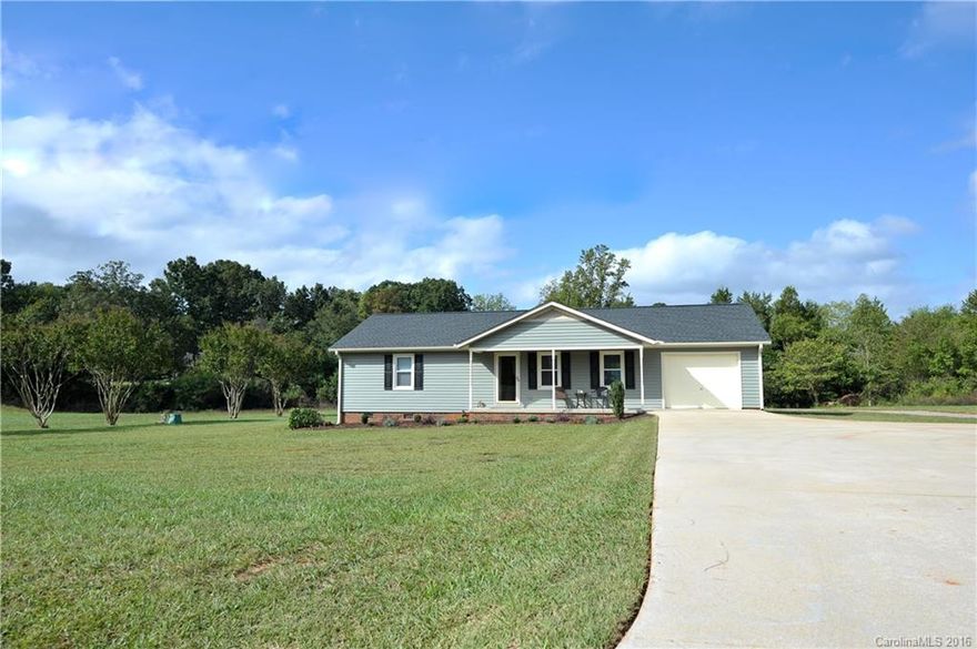Darling 2b/2b home w/ rocking chair front porch sits on a quiet street offering relaxed, peaceful living.  This beautiful home is situated on 1.24 acres & has been remodeled with all new windows, siding, shutters, roof, gutters, back sliding glass door, paint, new baths, & new floors. Open family room flows right into the dining and kitchen.  Also added this year is a 24 x 36 Metal Building with a concrete pad inside and 12 x 36 concrete pad in front. Great for a shop or storage!