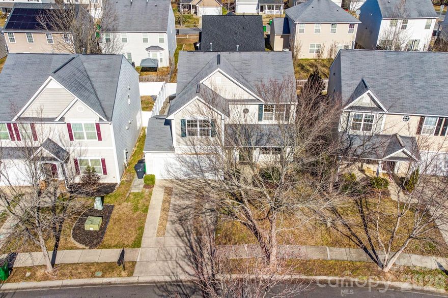 Welcome to 12733 Alvin Woods Drive, a beautifully maintained home ideally located in northwest Charlotte, offering convenient access to some of the area’s most desirable destinations while enjoying a more peaceful residential setting. Situated just minutes from Mountain Island Lake, Riverbend Village, and Uptown Charlotte, this home provides an exceptional balance of everyday convenience, recreation, and connectivity.

Inside, the home features a thoughtfully designed floor plan that offers both comfort and functionality. Upon entry, you’re welcomed into a dramatic two-story great room, where the upstairs is open to the main level, creating an airy, light-filled space with an impressive sense of scale. This open-to-below design enhances both the flow and visual appeal of the home, making it ideal for entertaining and everyday living.

The kitchen is well-appointed with ample cabinetry and workspace, opening seamlessly to the main living area to support both casual meals and gatherings with family and friends. Spacious secondary bedrooms provide flexibility for a variety of needs, while the primary suite serves as a private retreat designed for everyday comfort.

The primary bedroom is complemented by a well-appointed en-suite bathroom featuring a dual vanity, a garden tub, a separate standing shower, and a generous walk-in closet, creating a spa-like space to unwind at the end of the day.

Outdoor living is a true highlight of this home. The fully fenced backyard offers both privacy and versatility, while the large, beautifully designed back patio provides the perfect setting for entertaining, grilling, or simply enjoying peaceful Carolina evenings. Whether hosting guests or relaxing at home, this outdoor space significantly enhances the home’s overall livability.

The Alvin Woods community offers a quiet, neighborhood feel while remaining close to shopping, dining, parks, and major roadways. With quick access to I-485, I-85, and Highway 16, residents enjoy an easy commute to Uptown Charlotte, Charlotte Douglas International Airport, and nearby employment centers. Proximity to Mountain Island Lake, the U.S. National Whitewater Center, and local greenways provides abundant options for outdoor recreation, making this an ideal location for both active lifestyles and everyday convenience.

Combining a desirable Charlotte address, an accessible location, and comfortable indoor and outdoor living spaces, 12733 Alvin Woods Drive presents a wonderful opportunity to enjoy the best of city access with suburban ease.