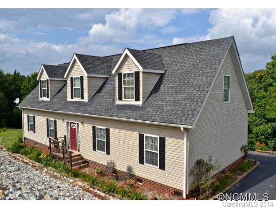 This lovely home situated on 2.25+/- acres and very conveniently located to I-40 is a must see. Gorgeous long range views of Short Off Mountain looking toward the Linville Gorge and other mountain ranges can be seen from the private back deck. Inside you will find a large open kitchen and den area, living room, large owner's suite with walk in closet, large bathroom with garden tub and access to the laundry room. Home is very well maintained!