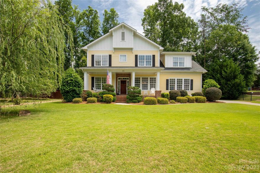 Curb Appeal lovers stop here! Stunning, craftsman style home located in the heart of Lake Wylie. This home features a welcoming front porch, just a few feet from the community playground and lake access for the kayak lovers. We love the quality build of this craftsman style home with tall ceilings and crown molding throughout, 10 inch base boards,  hardwood floors, open kitchen concept with gas cook top, granite counter tops, and an eat-in breakfast nook. This home features 5 bedrooms, or 4 with a large bonus room all upstairs, with a dedicated office. Large primary bedroom with 2 walk-in closets and large primary bath with garden tub. Perfect space to spread out. We absolutely love the huge covered porch and hot tub for hosting friends and family. This home's beautiful landscape has full irrigation and has a 5ft, fully fenced in back yard. The secluded community features year round events. Do not miss your opportunity to enjoy Lake Wylie and all it has to offer!