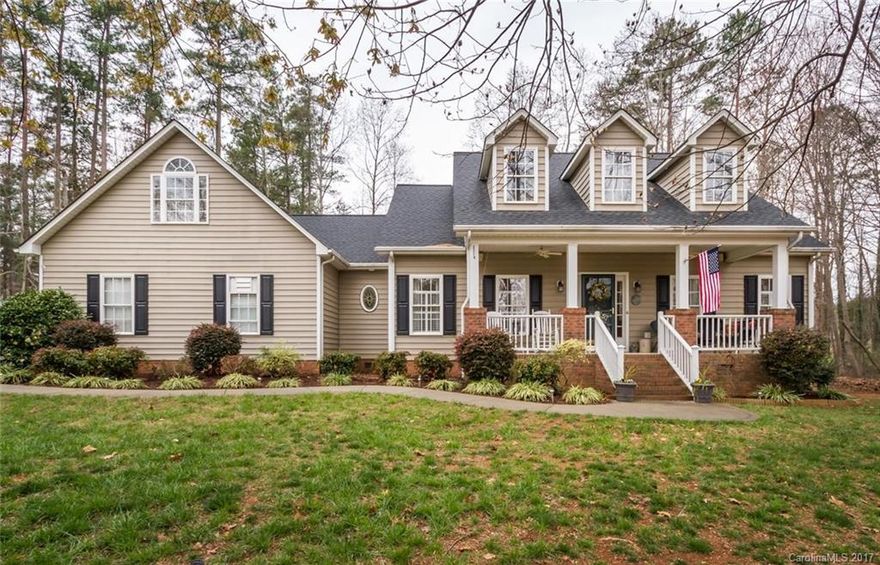 Lake Norman Access 5 min away! Beautiful trees & landscaping make this ranch home a true beauty. Split BR plan. Three full baths on main level. Newly painted kitchen cabinets & new granite counters. Gorgeous hardwood floors throughout main level. Relax on the spacious front porch in a swing or rocking chairs. Backyard is a hiatus w/roomy screened porch, fenced with outbuilding. The side yard big enough to accommodate a ball game or camper. Home provides year round lake views in serene setting.