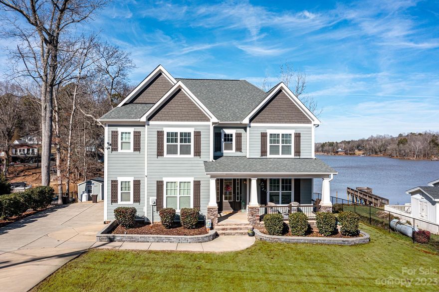 This home puts the PARADISE in Paradise Point! Long range lake views and a private dock with boat lift await you at  this turn key home. Modern elements highlighted throughout all 2869 sq ft including the kitchen with oversized island (love the storage), double ovens with gas range, wine cooler, pantry. When you must come in from the lake, french doors add privacy to the home office. Accent lights on the stairs lead up to three bedrooms plus a loft with access to the upper deck. Primary bath wows with free standing tub, oversized shower and spacious dual walk in closets. This custom built beauty checks all the boxes with a gorgeous interior and amazing waterfront views of Lake Wylie. 2 car garage, shed, front yard irrigation. Equi-distance from both Downtown Belmont and Town Of Cramerton. 5 min to Daniel Stowe Garden and walking trails.