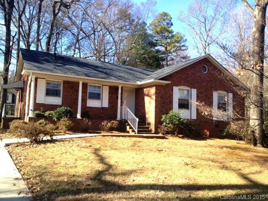 Great location! Minutes from Uptown, Southpark & I-277.  Charming 3BR 1.5BA brick ranch in lovely Coventry Woods. Hardwoods in entry, hallway & under carpet in living room and bedrooms. Large kitchen open to family room w/wood-burning FP. Huge bay window in living room overlooks large, flat yard. Nice size bedrooms.  Home has been well maintained & has several updates ~ New Roof 2011 ~ New Oven/Range Hood 2012 ~ New 50 Gallon Water Heater 2013 ~ New Concrete Driveway/Front Sidewalk 2013.