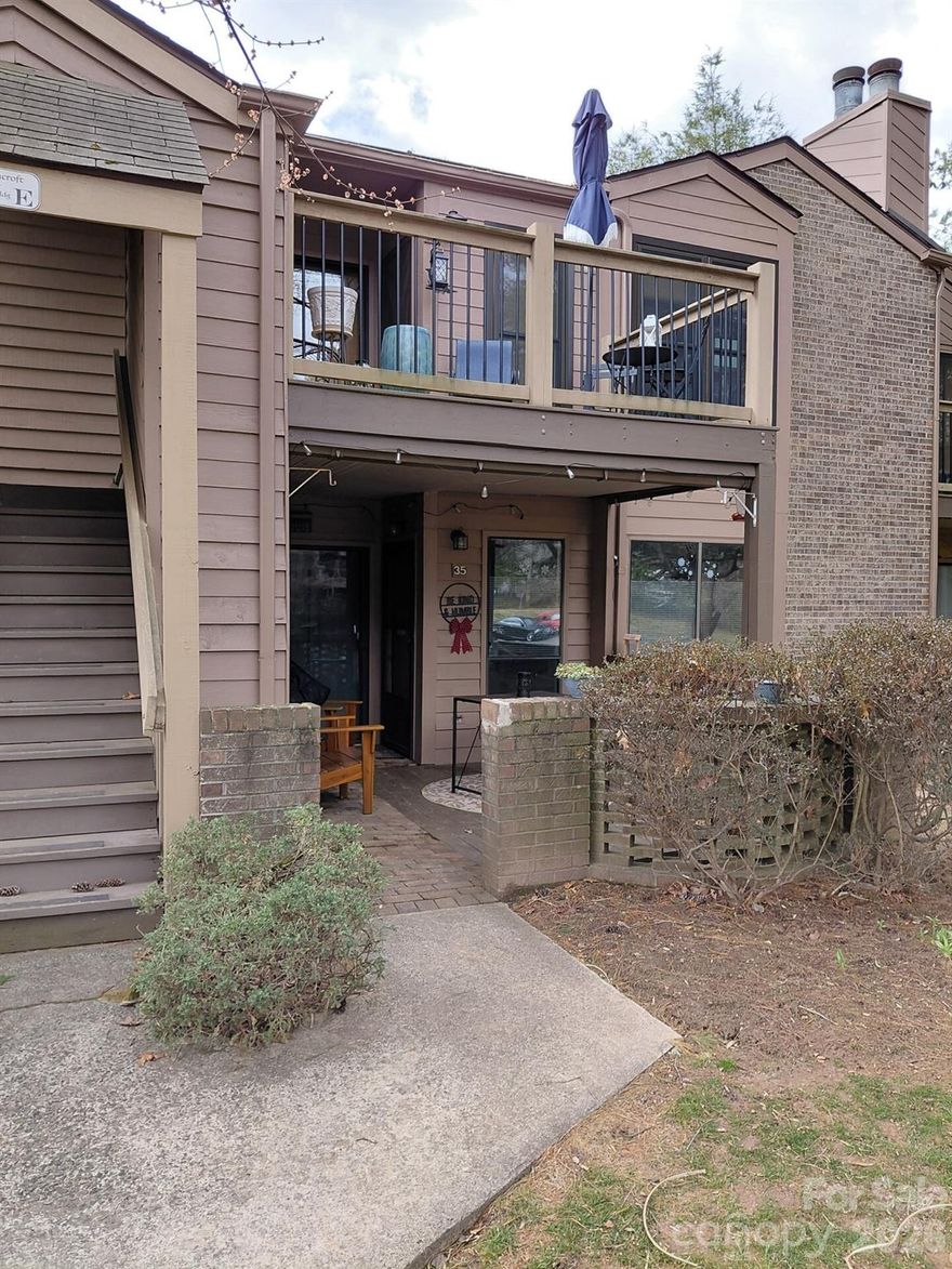 This charming condo located at 36 Ravencroft Ln in Asheville, NC was built in 1984 and offers 2 bathrooms, a total of 1,050.ft. of finished living space. Situated on a spacious lot, this cozy home provides a perfect blend of comfort and convenience. With its prime location and ample space, this property is ideal for those seeking a low-maintenance lifestyle in the heart of Asheville. This is a second floor unit that feels so private in a park like area with beautiful mature trees and landscaping. Beautiful hardwood floors, with ceramic tile in bathrooms and kitchen. Stainless kitchen appliances were installed I 2024. Bathrooms were updated in 2024. Living room has vaulted ceilings and a beautiful fireplace with gas logs. New windows in 2024. Two decks, with access to both bedrooms.