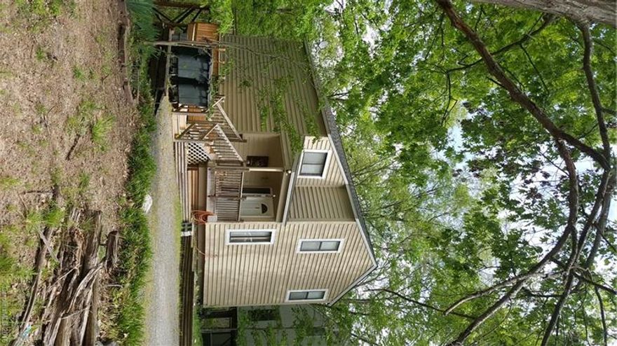 Nature surrounds this cozy cottage located in a lakefront community. French doors in 2 story living room open to partially covered back deck overlooking huge trees and a heavily wooded lot. High crawlspace area in back may offer options for additions and/or enclosure. New roof, HVAC and surrounding decking in 2011. New exterior paint. No HOAs. Coveted Fort Mill Schools. Enjoy all the amenities that living in Tega Cay has to offer - lake access, golf, tennis, playgrounds and walking trails.