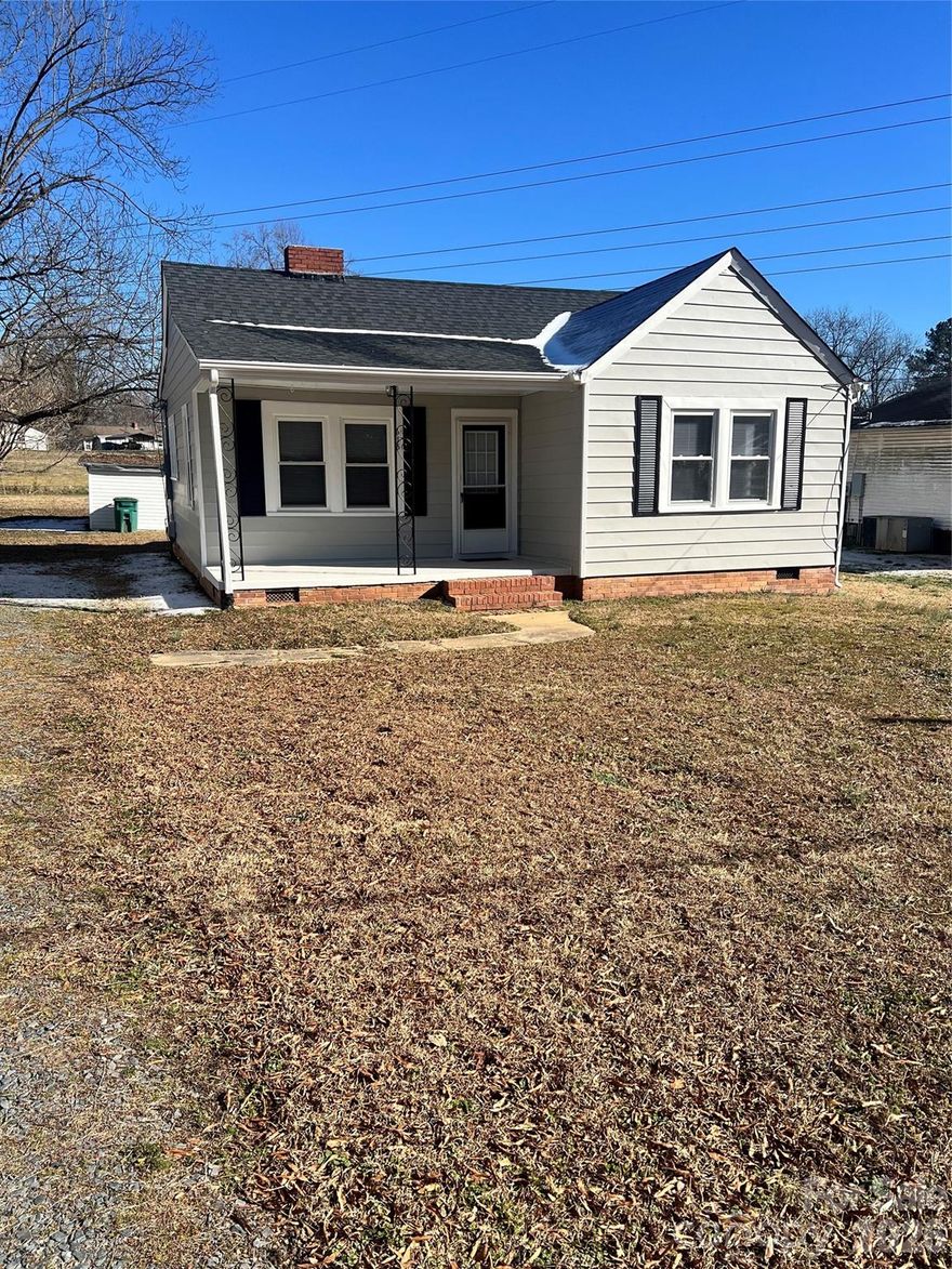 Welcome Home! - 615 Arlington Avenue welcomes visitors and guests with a covered front porch.  Step inside and this freshly painted home with new flooring in living areas provides a great place to entertain.  Spacious living room with tons of natural light leads to a central dining room with pantry.  Kitchen features tile counter tops.  Utility room from the kitchen and rear entrance provides space for washer and dryer and additional storage.  Each bedroom has a private entrance, but the rear and middle bedroom are connected by a common door.  Rear bedroom has a connecting 1/2 bath.  Center hallway leads to common full bath and additional bedrooms.  This listing is for 615 Arlington Avenue only: identified as Lot #24 in Plat 3 Page 152 which is part of PIN# 6538 04 81 1844.