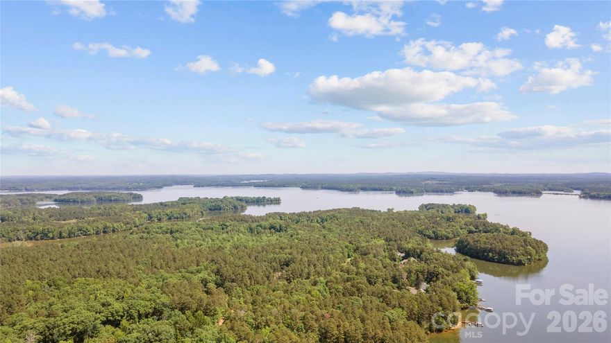 Beautiful waterfront lot on High Rock Lake's premier development, Emerald Bay. Emerald bay offers a peaceful setting backing up to the Eagle Point Nature Reserve. This tranquil waterfront lot has a deeded boat slip (#41), secure boat storage, and a boat lunch. Bring your builder or I can refer you to one, no required build time. Septic permit in place and valid through 2027.