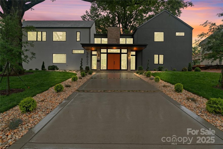 ~Sophisticated. Sleek. Unforgettable.~ This contemporary Cotswold residence captures the essence of modern luxury living where every detail was designed to impress. Live life on your terms in this striking contemporary home tucked within one of Charlotte’s most coveted neighborhoods, offering ultimate privacy and freedom with no HOA. Perfectly positioned on a private, landscaped corner lot surrounded by mature trees and an 8’ privacy fence, this home was crafted for those who appreciate bold design, functionality, and effortless flow. Accordion glass doors open to an inviting outdoor living area with a fireplace — perfect for relaxing or entertaining in style. Inside, soaring vaulted ceilings, engineered hardwoods, and designer lighting elevate every space. The chef’s kitchen is a showpiece, featuring a quartz waterfall island, walk-in pantry with prep sink, dedicated wine room, and premium **JennAir appliances**, including a 48” built-in refrigerator with obsidian interior. The primary suite feels like a private retreat with spa-inspired bath, vaulted ceilings, and custom finishes, complemented by two additional en-suite bedrooms and multiple flex spaces for work or wellness. Smart thermostats, tankless water heater, dual laundry zones, and pre-wired surround sound bring convenience to modern living. With an oversized 2-car garage, professional landscaping, and a location just minutes from Uptown, SouthPark, and the Charlotte Swim & Racquet Club, this home delivers the perfect blend of sophistication, privacy, and cutting-edge style.