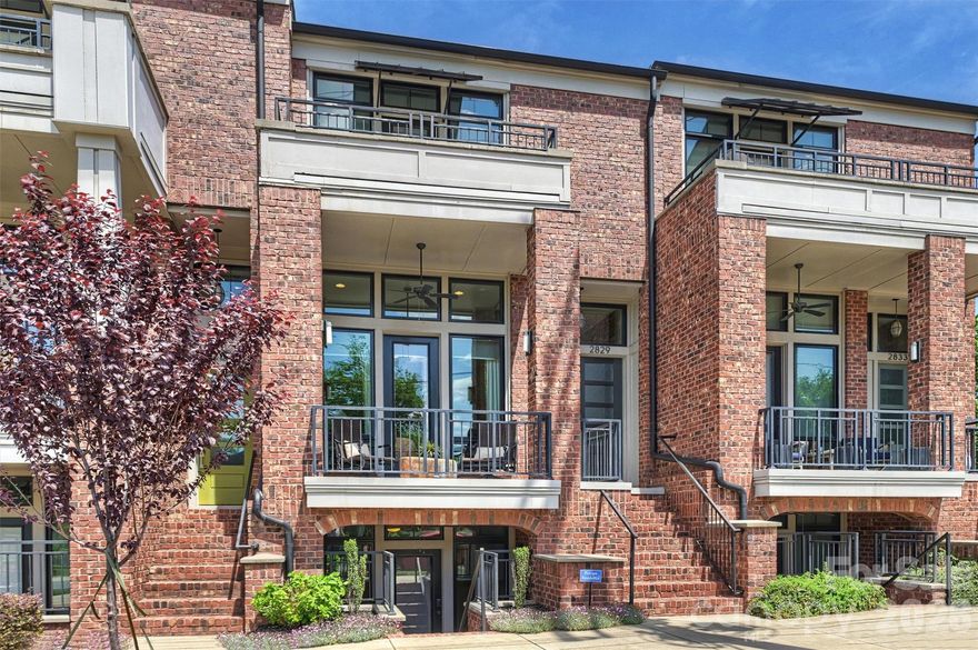 Modern Luxury meets urban living in this stunning 2018 Saussy Burbank townhome in the heart of NoDa. Thoughtfully designed with high ceilings, oversized casement windows and striking exposed brick, this home blends warmth with contemporary style.

The chef's kitchen features Bosch appliances and sleek quartz countertops, opening to a light-filled living space with gleaming hardwood floors perfect for entertaining. 

Upstairs, two luxurious primary suites offers spa inspired baths with double vanities, oversized showers generous walk-in closets and private balconies. The lower level provides a flexible third bedroom with a private entrance and kitchenette, ideal for guests, a home office or rental income. Complete with a two car attached garage and an abundance of storage. 

Thoughtfully designed by a high-end interior designer with elevated finishes including grasscloth wallpaper, striking Stark custom carpet and stair runner, and custom shades. This home truly offers turnkey living just steps from NoDa's eclectic galleries and nightlife. Walkable to the Lynx Blue Line, Heist Brewery, Ever Andalo, NoDa Brewing Company and Goodyear House just to name a few!