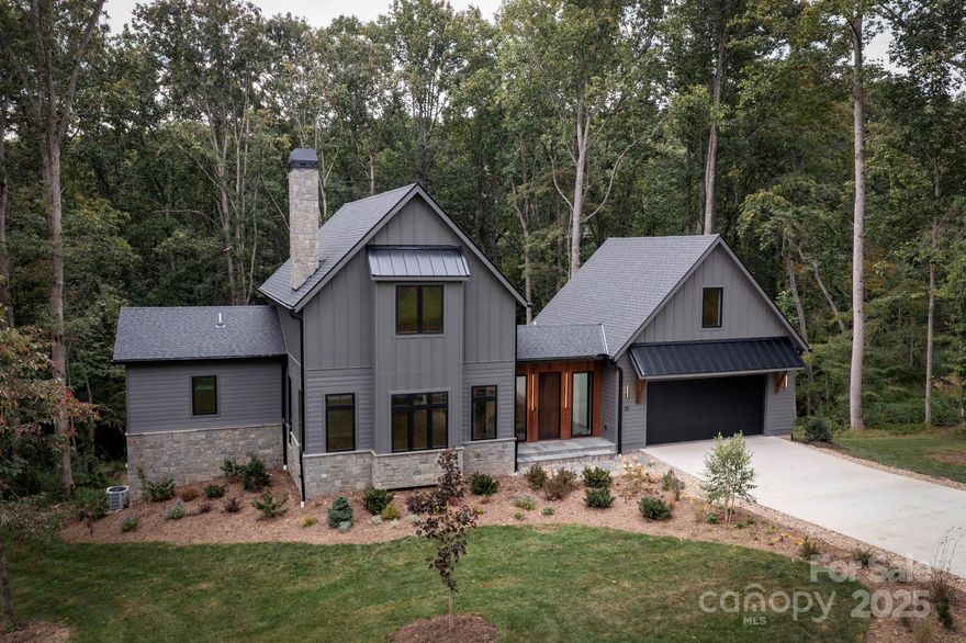 Experience stunning luxury and spectacular attention to detail in one of Fairview’s most desirable neighborhoods! The last available home in the budding community of Clearview, this exquisite new construction home offers beautiful landscaping, incredible curb appeal, and contemporary design. The home features 3,280sqft of finished space, including 4 bedrooms, 3.5 baths and a finished flex/office space with exterior access. Uniquely designed entry dogtrot features custom blue stone flooring, floor-to-ceiling windows and a beautifully finished powder room. The open and inviting main level boasts 10-ft ceilings, bespoke details and finishes, 7.5 inch wide plank hardwood flooring, and a stunning floor-to-ceiling rolled steel fireplace.  A show-stopping chef’s kitchen features high-end appliances, panel refrigerator, custom cabinetry and gorgeous quartz countertops, with ideal access to private deck space. The vaulted main-level primary suite with spa-inspired ensuite bath and laundry space round out the main level.  Two spacious bedrooms await on the second level, each with walk-in closets, work areas, and a beautifully finished shared full bath.  The basement level features a spacious bonus room, fourth bedroom, full bath, and ample storage space with ability to finish.  The large lot features lovely, private, and gently rolling yard space with amazing privacy.  Agent part owner in project.