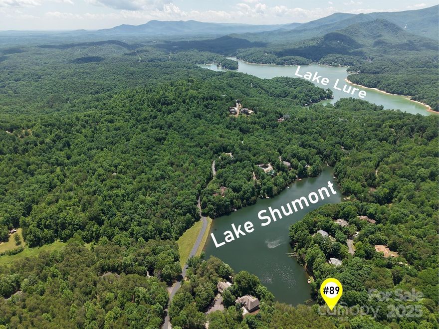 Huge Price Reduction!! Rare Shumont Lakeview property in the prestigious Rumbling Bald on Lake Lure community. Tucked away in a quiet cul-de-sac with a gentle, buildable slope —where glimpses of water sparkle through the trees—this is more than land; it’s possibility. Imagine morning coffee with birdsong, afternoons on a private beach, evenings by the fire after hiking, golf, or pickleball. With underground power, high-speed internet, and short-term rentals allowed, your retreat or investment is ready to take shape. Adventure and tranquility live here. Amenities: Two championship golf courses for year-round golf, Wellness Center, spa and salon, on-site dining, Coffee Shop, private beach, water park, four pools, Pickleball/Tennis courts, hiking/biking trails, Putt-Putt golf, boating, and more. Don't miss this opportunity. Schedule your private community tour today.