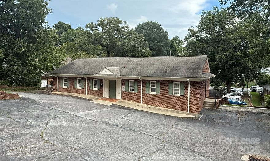 MEDICAL OFFICES FOR LEASE ACROSS FROM CALDWELL MEMORIAL HOSPITAL-Take advantage of the perfect location for your medical practice surrounded by various medical and non-medical businesses. Spacious 2-story building offers 2 separate units. 308 Mulberry St, SW is on the lower level and across from UNC HEALTHCARE/CMH. It has 2048 +/- sf and offers a large lobby & front desk, waiting area, 2 doctors' offices, 4 exam rooms, break room, 2 bathrooms, storage rooms & more. Spacious parking lot consists of 24+ spaces & a designated area for signage. 233 SW Main St is on the upper level and also has 2048 sf +/-. This unit also has a large reception/lobby area, 9 exam rooms, several storage locations and 2 bathrooms--one of which has a shower. This unit allows for 10 parking spaces. Each unit leases for $1,550/month. Previous tenant began several improvements, however, tenant vacated the property prior to completing all improvements. Most materials remain in the units for completing  renovations.
