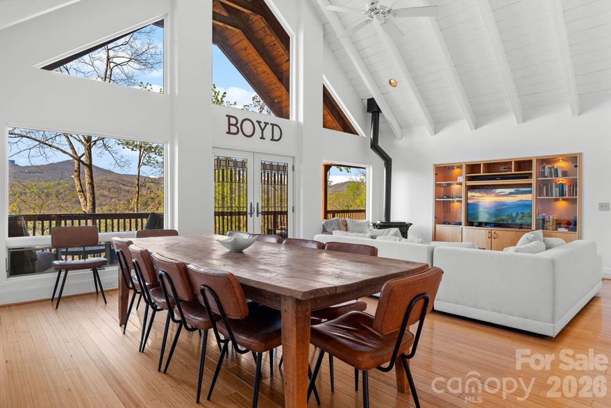 Perched just above the charming town of Banner Elk, this spacious home delivers the best of mountain living — peaceful enough to hear the leaves rustle, yet close enough to hear the music drifting up from the town park on Thursday summer evenings. In winter, skiing at Sugar Mountain and Beech Mountain awaits just 15 minutes away. Year-round, downtown Banner Elk's shops and restaurants are less than half a mile from your door. Arrive to ample parking and take just four easy steps up to the main level — single-level living if desired. The full-length rocking chair front porch sets the tone immediately, welcoming you to the mountains. Step inside to soaring vaulted ceilings and an open-concept living, dining, and kitchen area finished in a white-washed style that brings a fresh, modern feel. The kitchen offers a generous island with breakfast bar seating. There is a comfortable living area and a large dining table to seat everyone. And yes, the home is offered fully furnished, with just a few exceptions. The main level follows a split floorplan. On one side, the spacious primary suite features a bright, beautifully renovated bath and en-suite laundry — plus direct access to the full-length back deck, where views over the town of Banner Elk await. On the other side, two additional bedrooms each open to the front or back deck, and share a well-appointed bath. Every bedroom is genuinely spacious; no one draws the short straw here. The lower level offers tremendous flexibility — a huge living area, a fourth bedroom with seating area, and two full baths give guests or family members a retreat of their own- including a separate entrance from the driveway. On the lower back deck, you’ll find a concrete slab and wiring already in place for a hot tub. The oversized, attached two-car garage opens to this level. The owners have taken exceptional care of the home: a new roof (2019), sanded and stained (2020), new retaining wall and 1,000 gallon propane tank (2020), repaved driveway (2022), new water heaters (2026), a new A/C compressor (2026), and more! No HOA, and the home is on city water and sewer and a city maintained paved road. This home is move-in ready and built to last. Whether you're looking for a full-time mountain home, a vacation retreat, or an income-producing rental property, this home checks every box. When you can't be here — and you'll always wish you could — the rental potential is excellent.