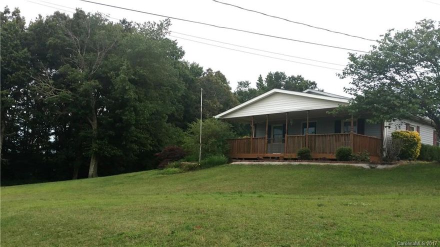 2 acres and a beautiful hilltop setting for this charming cottage. Large front porch to enjoy the views. Open floor plan between living room, dining room and kitchen give this home a spacious feel. Two large bedrooms and a full bath. Land is open and wooded. There is one outbuilding for storage and another shed that could be used for storage or possibly a horse if zoning permits. Deck replaced in 2013, septic pumped every 5 years. Recent upgrades and maintenance to HVAC and ductwork. Must see!