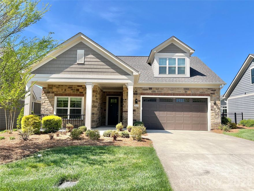 Beautifully upgraded 3-bedroom, 3-full-bath home in a small, highly desirable 55+ community, thoughtfully designed for high-quality, low-maintenance living. Situated on one of the best lots in the neighborhood with a $30,000 lot premium, this home offers stunning lake and fountain views. Nearly every builder upgrade was selected, totaling over $148,000 in options.
A formal entryway opens to an open, efficient floor plan showcasing exceptional craftsmanship throughout. The airy first floor features 10-foot ceilings and 8-foot solid-core two-panel cove doors, adding a refined architectural touch and enhanced sound insulation. Fresh neutral paint flows throughout the home, including the garage.
The gourmet kitchen is equipped with a gas range and hood, double wall oven, oversized center island, abundant cabinetry, and generous counter space, opening seamlessly to a light-filled dining area and great room anchored by a striking brick-enclosed fireplace. The sought-after first-floor primary suite boasts a tray ceiling, walk-in closet, and a spa-like en-suite bath with dual vanities and an oversized zero-threshold tiled shower.
Step directly from the great room or primary bedroom into the private courtyard with covered patio and ceiling fan, ideal for outdoor relaxation. Enjoy tranquil lake, fountain, walking trail, and wooded views from the courtyard, great room, and primary bedroom.
A secondary bedroom with a full bath and a formal office are conveniently located on the main level. Upstairs, a spacious bonus suite—featuring an open living area, third bedroom, and full bath—provides excellent guest accommodations or flexible living space. The garage includes a tankless gas water heater and a 220V 50-amp EV charger.
HOA amenities include lawn care (outside the individual courtyard), clubhouse, fitness center, swimming pool, walking trails, and social events with an active calendar. Ideally located near shopping, Concord Mills, and I-85, this exceptional home offers comfort, convenience, and a true lock-and-leave lifestyle.