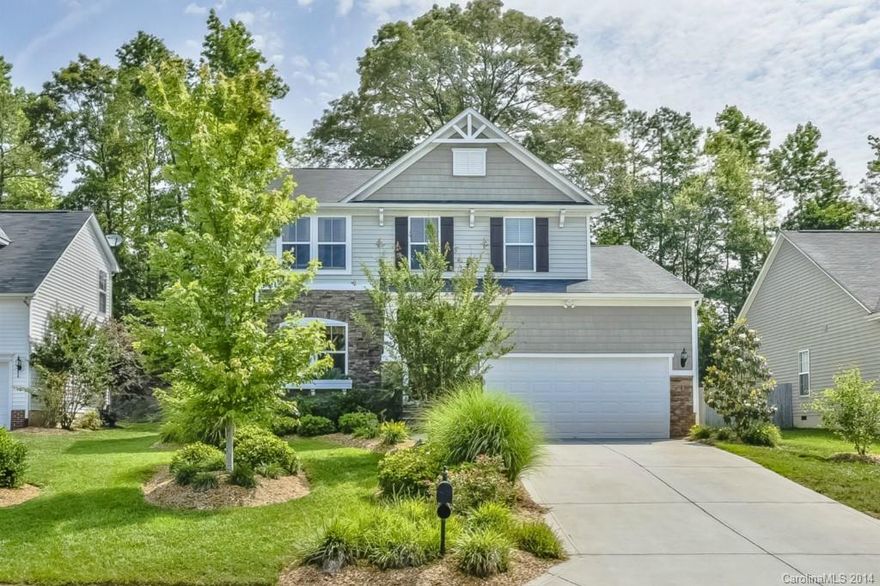 Fabulous Stone Accented Home on Cul-de-sac Street! Airy Sunroom, Deck & Patio overlooking terraced off lush level lawn!  Hardwoods flow from Great Room with fireplace to Kitchen with work island, bar & walk-in Pantry. Upper versatile Loft. Security system & storage galore in Garage. Brand new school & Bypass under construction make this location dynamite!