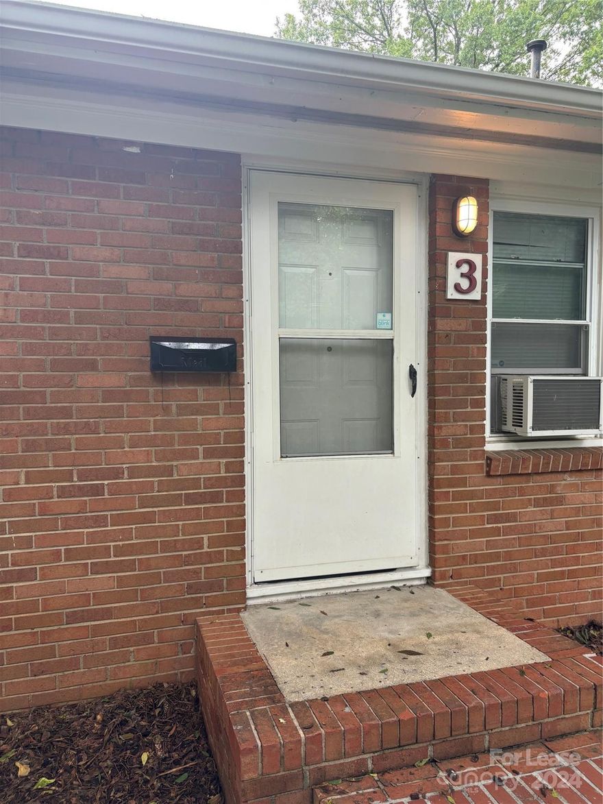 Historic Wesley Heights Neighborhood.  This move in ready cute two bedroom 1 bath home is located in a quiet fourplex, nice wood floors and is freshly painted and newly updated to include washer and dryer in unit.  Close to downtown, Panthers Stadium, Johnson & Wales and interstate.