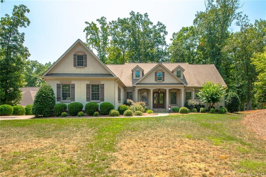 LAKE WYLIE! Custom waterfront beauty with floating dock on private cove. Just a short distance to new Berewick shopping, restaurants, outlets makes this a fantastic location. This sprawling ranch style home with bonus room and loft (sitting on almost a full acre of land) has every detail covered. Gourmet kitchen with double ovens, 1st floor master suite, vaulted ceilings in the great room, so much to list. The serene screened porch with fireplace is an epic place for taking it all in. MUST SEE!