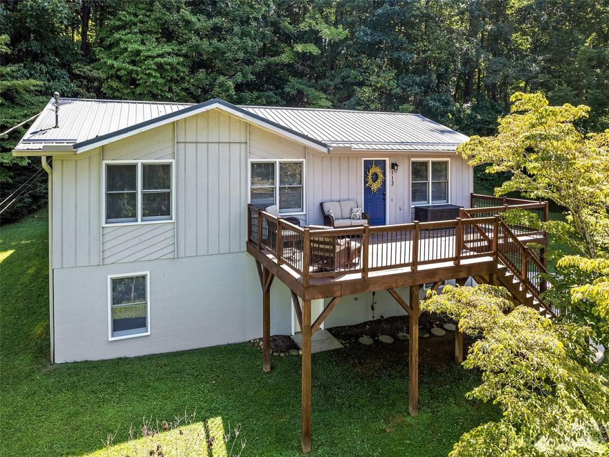 Cute cottage with in-town convenience! Located just a few blocks from Main Street Waynesville this updated cottage has many possibilities. Currently a vacation rental, it could be a year-round residence or second home with its easy access! 3 bedrooms, 1 ½ baths, nice sized living room and kitchen/dining area. Tastefully updated with LVP flooring, updated kitchen and baths. Lots of storage and great closet space! The basement has two heated and finished bonus rooms ready for an office, workout, craft storage room! Lots of options! Elevated front deck with great views of surrounding mountains and town below. The back deck is a spot you can soak in nature while relaxing with your favorite beverage or book! Conveniently located in downtown Waynesville where shops and restaurants abound and are a just short distance away!