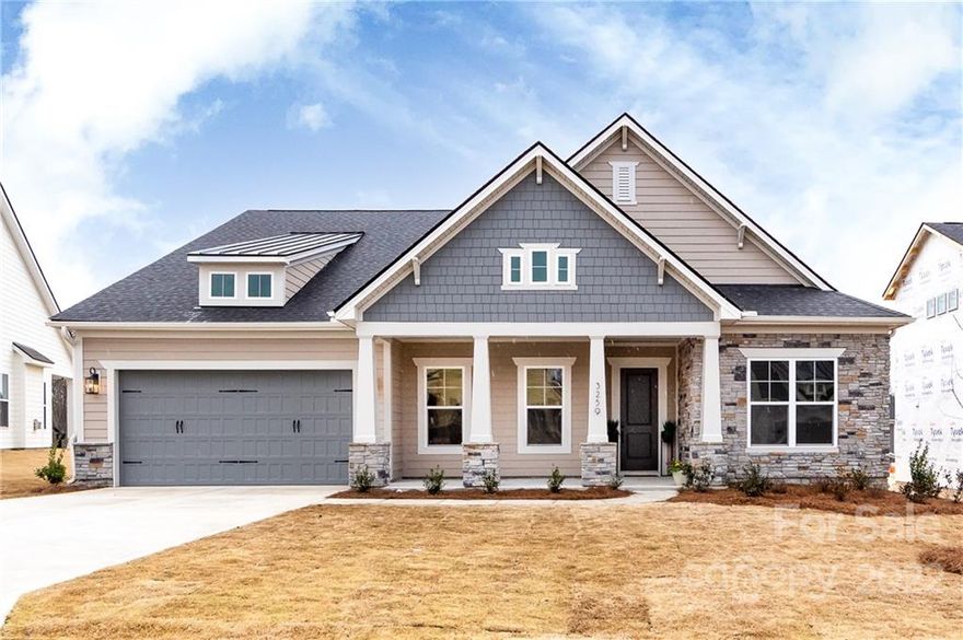 Stunning new construction within minutes of the new Indian Land High School.  This dream home is luxuriously appointed with 10 foot ceilings and 8 foot doors on both levels, gorgeous millwork, black door hardware and generous upgrades with an open floor plan filled with natural light.  The mammoth kitchen island is an entertainer's dream with ample seating; white kitchen cabinets extend to the ceiling for additional storage.  The vibe is sleek and clean with white quartz countertops and modern matte black hardware.  The crown of the main-level primary suite is the massive tiled shower that evokes a day at the spa, while the walk-in closet connects to the laundry room for day-to-day ease.  The bonus room has a closet, a full bath and ample space for work or play.  Outdoors the front and back covered porches are large and there is an in-ground irrigation system.  Convenient location 11 minutes to downtown Waxhaw and 7 minutes to tons of shopping in Indian Land.  Showings start 3/18.