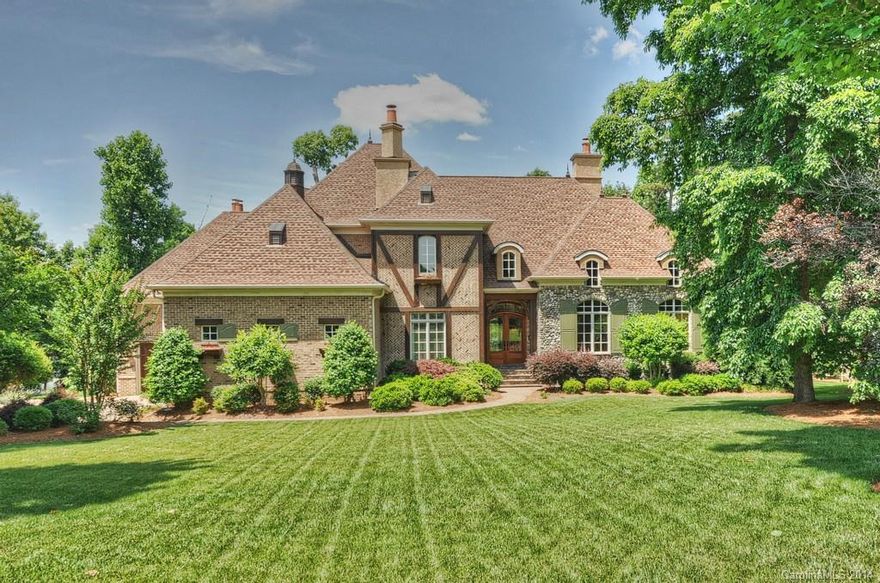 Lake living at it's finest, beautiful French Country home on a secluded deep water cove.  This home includes 5 fireplaces, 2 full kitchens, a wine room, exercise room with a sauna/steam room. 5 Bedrooms all with private baths. The owners suite is on the main level and has a 2 sided fireplace. Formal and family spaces including billiard and card areas, all with magnificent views of Lake Norman.