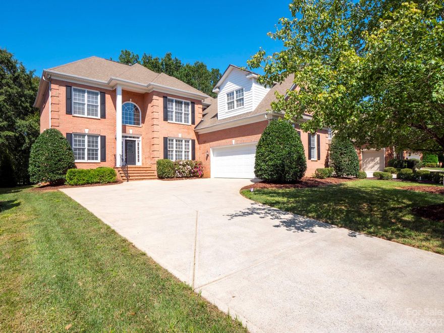 Stunning full RED brick home in the highly sought after Vanderbilt at Providence. 5 beds, 4 full baths w/ oversized 2 car garage. Gorgeous 2 story ceiling foyer and great room with 3 huge half-moon windows. The hardwood floors newly refinished to perfection. A formal dining and living room at the foyer. A guest bedroom downstairs. Spacious kitchen features classic Corian countertops, range hood venting to the outside, electric cooktop, double ovens, walk-in pantry, and a personal planning center. A butler's pantry with cabinet. Breakfast nook leads out onto a paver porch. Luxury laundry room w/ cabinet and sink.  Upstairs features 3 beds w/ walk in closets and 2 full baths, ensuite & Jack-N-Jill. Primary bed w/ a walk in closet and a sitting area. Wooded backyard and golf view! HVAC Up 2022 and Tankless Water Heater 2019. Unbeatable location near Waverly, Rea Farms, Blakeney, Ballantyne & many more. Google fiber installed recently.  The top-ranked Rea Farms and Ballantyne schools!