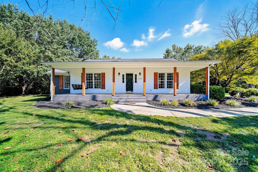 Peaceful living awaits in this charming brick home! Nicely updated one-level home on a level 1.36 acre lot on a quiet street with a small barn and shed. This one-level home features three bedrooms and two full baths, an updated kitchen featuring newer stainless appliances, a bay window eating area, and large living room with gas log fireplace. The front porch offers beautiful views of the serene, quiet surroundings. A paver patio has been built to accommodate outdoor gatherings. An enclosed carport offers storage for two vehicles, and features a gorgeous new garage door. The concrete drive allows for multiple other vehicles to park. Acreage includes black walnut trees, fig trees, grape vines, raised planters and a pear tree. Barn is believed to be 100 +/- years old. Attic storage over carport.