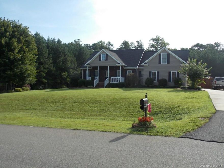 Tranquil ranch home with second floor bonus room within the Clover School District.  Relax on your one acre lot, sipping a cup of tea on your front porch or rear attached deck.  The home features a split three bedroom layout with hard wood floors throughout the living areas, and an open kitchen.  The kitchen includes bar seating that opens to a breakfast seating area and an open great room that features a gas fireplace.