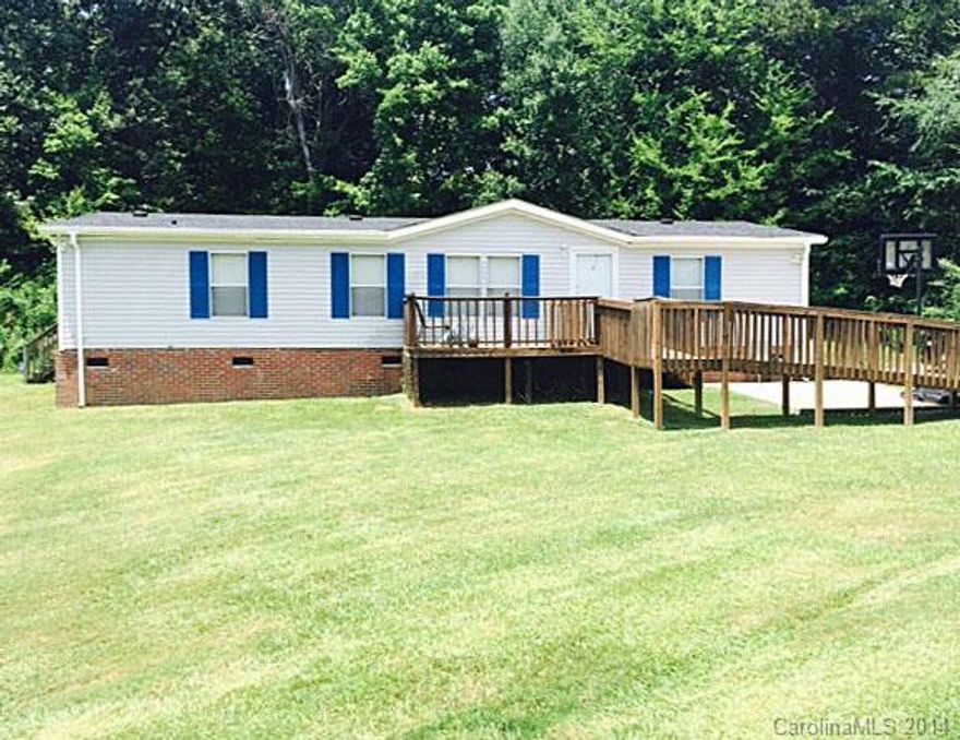 Wonderfully Maintained Double wide w/ brick foundation. New Roof in 2011.   Perfect for those looking for country living with plenty of space for outside events or  large gatherings! One year home warranty provided through old Republic.  Schedule today without DELAY!