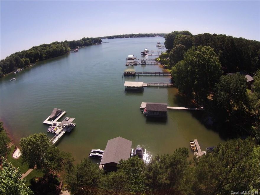 Great Craftsman Style Waterfront home w covered front porch. Exterior features inc covered boat slip w new solar hydraulic lift & room for 2 boats + jet skis, views of main channel, large deck w stone fire pit, fenced in yard, back screened in porch w remote to raise screens & convert to open porch, extensive landscaping & gardens. Interior features open floor plan plus updated kitchen, Sonos home ent system, huge master, 2 stone fireplaces, extensive moldings & hardwoods. Way too much to list!