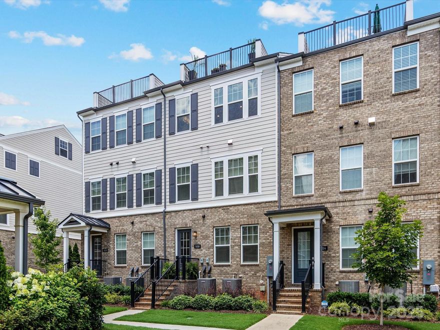 Welcome to this 2022-built Townhome in coveted Elizabeth neighborhood offering space, style, and versatility across four thoughtfully planned levels. The entry level features a private bedroom and full bath and a spacious 2-car garage. The main level boasts an open-concept living and dining area that flows into a kitchen with a large island and stainless steel appliances A convenient half bath completes this level. Retreat to the next floor, where you’ll find the primary suite with bath and walk-in closet, plus an additional bedroom, full bath, and laundry closet. At the top, a stunning flex room with a half bath opens to a private rooftop terrace—your personal escape for relaxing or entertaining while enjoying breathtaking sunset views. With contemporary finishes, abundant natural light, and a functional layout, this townhome offers the perfect blend of comfort and convenience in a sought-after location walkable to restaurants, parks, and minutes from Uptown.