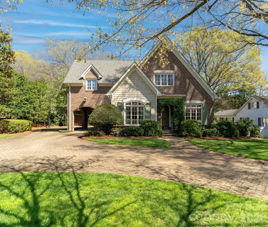 Located on .49 acres in the beautiful Myers Park neighborhood, this custom-built 5 bedroom home combines charm with functional design—built for entertaining and daily living. 10-foot ceilings on the main level and 9-foot ceilings upstairs create an open, spacious feel throughout. The recently updated chef's kitchen features Taj Mahal quartzite countertops and premium appliances including Thermador double ovens, Sub-Zero refrigerator, Sub-Zero wine fridge, and Bosch dishwasher. Two bar areas and an open layout to the family room provides effortless hosting. 
The downstairs primary bedroom includes heated bathroom floors, separate walk-in closets, and washer/dryer connections with direct access to the private terrace and fenced backyard. Upstairs you'll find three spacious bedrooms, an upstairs laundry room, and a bonus room providing plenty of space for everyone. In addition, the 440-square-foot guest suite above the 2-car garage has a private entrance and full bath—ideal for visitors, a home office, or multigenerational living.
The covered terrace features a gas fireplace, Weber grill connected to a built-in gas line, and overlooks a gorgeously landscaped fenced yard. A large circular driveway with porte-cochère offers easy loading and unloading. 
Recent updates include: new HVAC systems (2018, 2024), crawlspace encapsulation (2023), fresh paint interior (2022) and exterior (2020). 
This home is well-maintained, move-in ready, and conveniently located to excellent schools, upscale retail and dining.