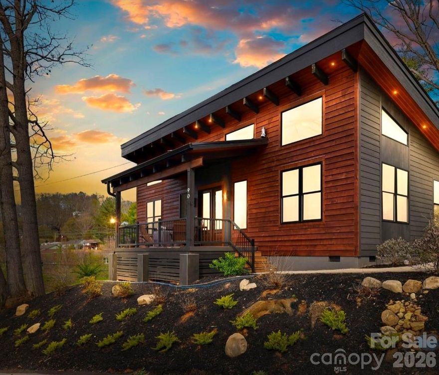Step into this stunning modern one-story home, perfectly situated within easy walking distance of downtown Waynesville. Designed with both style and comfort in mind, this modern build residence boasts an open, airy floor plan highlighted by elegant, vaulted, tongue-and-groove ceilings, warm wood beams, soft recessed lighting throughout, and flooded with plenty of natural sunlight.

The kitchen is a true showpiece, featuring a striking black Italian marble backsplash, gleaming granite countertops, stainless steel appliances, a Kraus farmhouse sink, custom knotty alder cabinetry, and a spacious pantry. The bathrooms offer a spa-like retreat with a luxurious walk-in shower, a shower-tub combo, and stylish vessel sinks. Solid knotty alder doors and thoughtfully placed windows that fill the home with beautiful natural light from morning to evening.

Outside, the craftsmanship continues with a blend of wood and high-end smart siding, accented by Italian porcelain details, tongue-and-groove soffits and covered deck ceilings, complete with recessed and can lighting. The backyard is thoughtfully laid out with a natural stone pathway leading to a cozy west facing fire pit, allowing you to take in those amazing Blue Ridge/Smokey Mountain sunsets. This is a true slice of heaven that creates the perfect setting for relaxing or entertaining. Perennial landscaping add the perfect splash of color to the yard making it the perfect lock and go property for super low maintenance, ideal as a year round or seasonal residence, and with no restrictions, a perfect SHORT TERM RENTAL/ AIR BNB/VRBO income producing property.
Enjoy the convenience of nearby Waynesville's dining, shopping, and local events within half a mile of your home, and Asheville just a short 30-minute drive away. With quick access to medical facilities and a prime location near everything these Great Smoky/Blue Ridge Mountains has to offer, this home truly has it all. Don’t miss your chance to make it yours! This property is true perfection!!
Contact Listing Agent for your private tour.