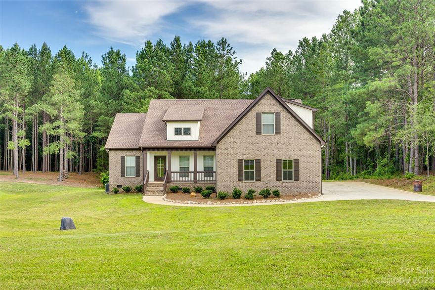 This beautiful home sits on an over an acre lot in sought after Lauren Pines. The home features 4 bedrooms and 3 baths and has all the upgrades with granite counters, stainless appliances, vaulted ceiling in the great room. There are big front and rear porches where you can relax and enjoy your coffee and watch nature at its best! It also features a two-car garage, gas stove, gas heat, and gas fireplace in the Great Room. Exceptional attention to details abound in this home!