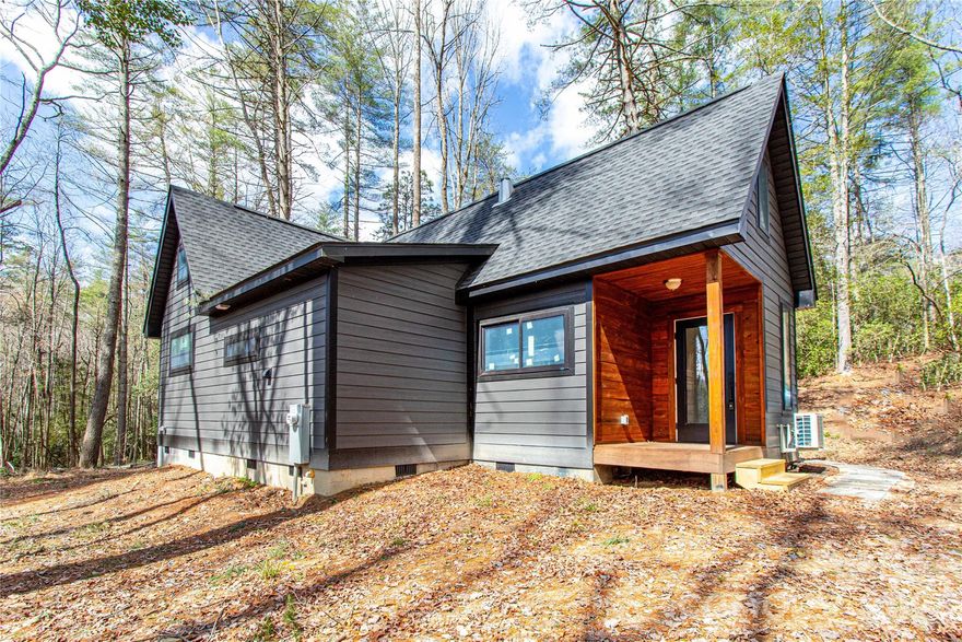 Tucked away on a private, secluded lot, this beautifully crafted 2025-built cabin offers the perfect blend of modern comfort and peaceful natural surroundings, an ideal mountain getaway. A gently flowing creek adds to the serene setting, creating a true escape from the everyday. Inside, you’ll find hardwood floors throughout and stunning tongue-and-groove vaulted ceilings that elevate the spacious living area with warmth and character. The open layout is complemented by a large bathroom featuring a built-in shower, as well as a versatile loft and additional storage loft for added functionality. Step outside to enjoy the expansive deck, perfect for relaxing or entertaining, along with a welcoming covered entryway. The relatively flat, open lot is dotted with mature trees, offering both usability and privacy. The property is thoughtfully equipped for future possibilities, including a designated RV parking area and a 3-bedroom septic system already in place for potential expansion. An outbuilding provides additional storage for tools, gear, or recreational equipment. Whether you're looking for a full-time residence, weekend retreat, or investment opportunity, this cabin delivers the ultimate mountain getaway with a rare combination of privacy, natural beauty, and modern amenities.
