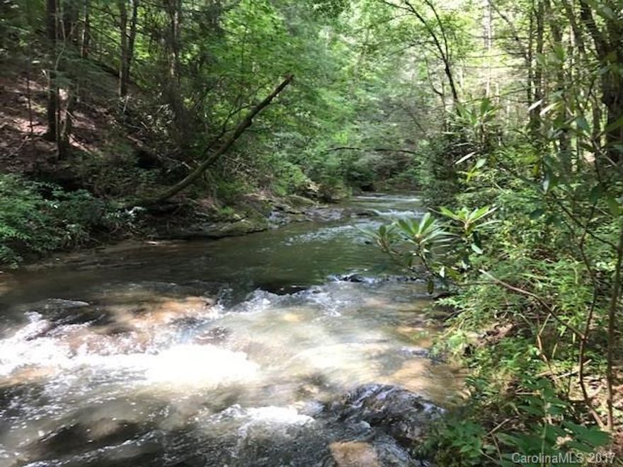Large 2.93 acre with 115' on beautiful Ostin Creek(trout stream), Several building sites to choose from, up on high ground or down overlooking the bold creek surrounded by mature pines. Great lot with many options priced to sell.