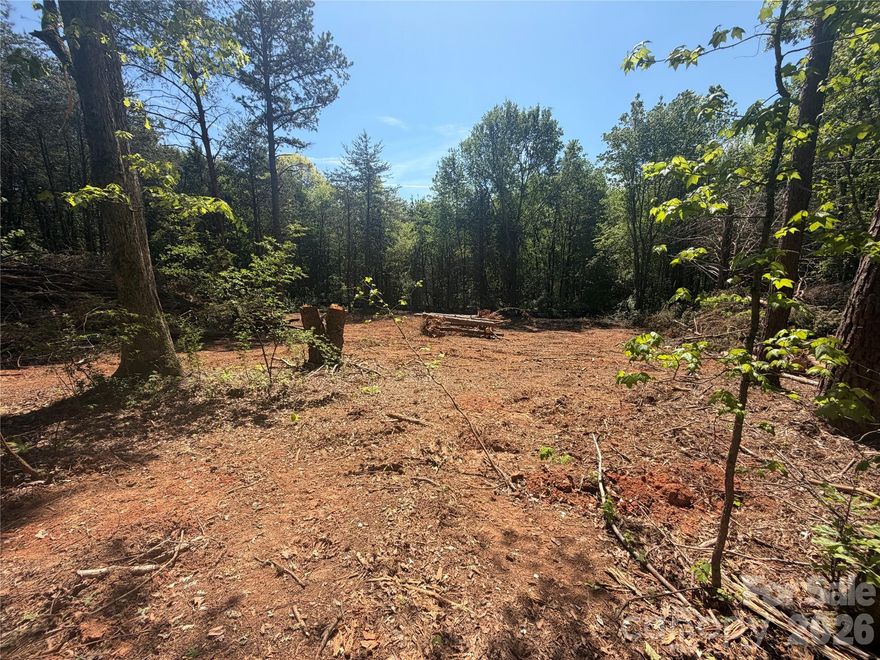 This beautiful, partially cleared, flat 1.01 ACRE parcel offers flexibility, privacy, and convenience all in one! Zoned R-T in Lincoln County, this property has perced for a 4 BEDROOM HOME and is located in the desirable NORTH LINCOLN SCHOOL DISTRICT. A well will be required. With NO HOA and NO RESTRICTIONS, you have complete freedom to design and build exactly how you want. The property is zoned R-T.  With no HOA, you’re free to keep your boat, RV, tractors, or other toys right on your property! Dreaming of a mini / hobby farm or a barndominium? Build it here! Even more, the location being only a few miles from the intersection of highway 16 and 150, makes commutes to Lincolnton, Hickory, Mooresville, or Charlotte effortless. This property is currently owned by a custom builder. Inquire with agent to speak with him about custom options. Building with owner is not required.