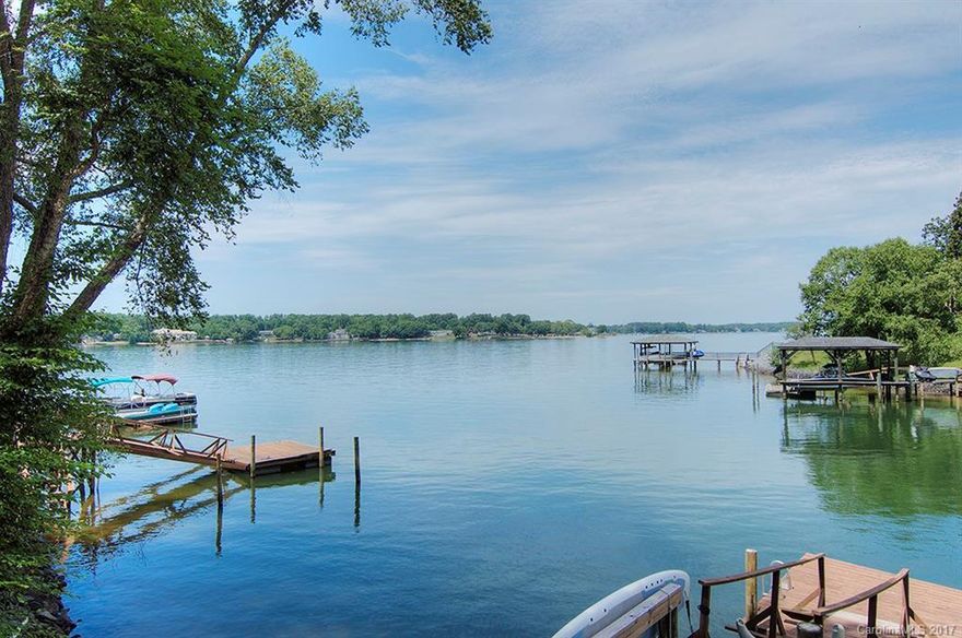 Glorious sunsets, calming views. Offers the best of Lake Wylie waterfront & move-in ready renovations. Lake lifestyle complete w multiple decks & screened porches. Dreamy master suite w a stunning fireplace, private balcony + a to-die-for master bath. Main level features eat in kitchen, dining room & great room w stone wood burning fireplace. Beautifully selected custom fixtures, lighting, & accents. New main/basement HVAC.Tons of storage, garage workshop.Tega Cay vacation lifestyle, FM Schools!