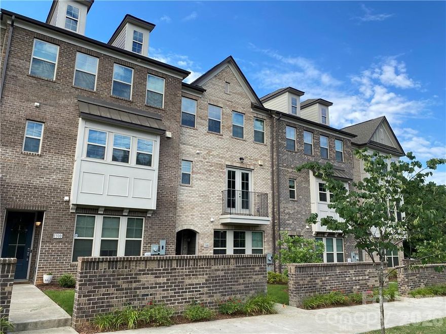 All brick townhome located in the highly sought after Montford area, within walking distance to Park Road Shopping Center, Montford Drive and a 5 minute drive to South Park. Townhome is 3 levels with 2 car garage. 3 large bedrooms each with their own bath and dual masters.  Granite countertops, stainless steel appliances and open floor plan for living area with oversized sliding glass doors leading to large private balcony. Townhome has hardwood floors, plenty of storage and walk in closets. Do NOT miss this!