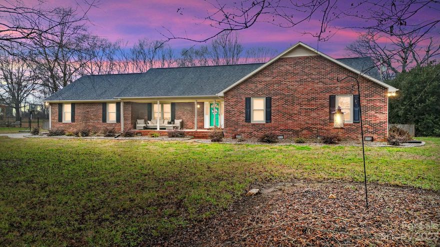 Rare opportunity in desirable Harrisburg! This fully updated brick home sits on nearly one acre. The kitchen features stainless steel appliances, solid surface countertops, new cabinetry, and modern light fixtures. Granite composite sink with a garbage disposal.  Stunning engineered hardwood flooring span the entire house, creating a seamless and elegant look. Smart switches compatible with Alexa throughout (excluding bathrooms).  Key updates include a new roof & HVAC system within the last 3 years, with bi-annual maintenance to the HVAC. Both bathrooms have been tastefully remodeled, boasting tile walk-in showers, new vanities, and stylish tile floors.  The backyard is fully fenced with a large deck perfect for outdoor entertaining. Dive into fun with an above-ground pool.  Explore your green thumb in raised beds and blueberry, blackberry, raspberry, and mulberry plants.  Don't miss the chance to own this turnkey property that blends modern amenities with timeless charm.