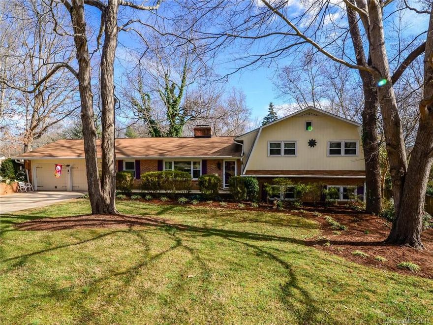 Split-level home in country setting w/ mature trees and large yard.  Main level has formal living room & dining room w/ wood floors, den w/ wood-burning fireplace and kitchen. Three large bedrooms and two remodeled baths on upper level.  Lower level has large finished family room, kitchen/eating area, laundry and half bath and door to back yard.  Screened porch has broken tile floor and ceiling fan.  Convenient to shopping and schools.  Easy access to I-85