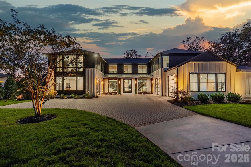 Step into a world of sophistication in this stunning contemporary home. This architectural marvel, custom-built by Courtland Homebuilders, boasts soaring ceilings & walls of windows flooding the space with natural light. Unparalleled lighting collection, world-curated with the finest craftsmanship. The open-plan main living space is a state-of-the-art entertainment area that seamlessly connects to a travertine patio and pool deck with a saltwater pool and outdoor kitchen, all overlooking Lake Norman. Experience year-round comfort in the remarkable four-seasons room, with versatile, remote-controlled panels. Luxurious top-of-the-line materials used throughout such as porcelain counters with waterfall edges and Phillip Jeffries wallpaper. Primary and guest suites on the main level. Upper level with loft, spacious rooms, office/6th bedroom, and lounge area with bar. 2 heated/cooled show garages, a beach, fire pit, and a pier with boat slip. This property redefines luxury lakeside living!