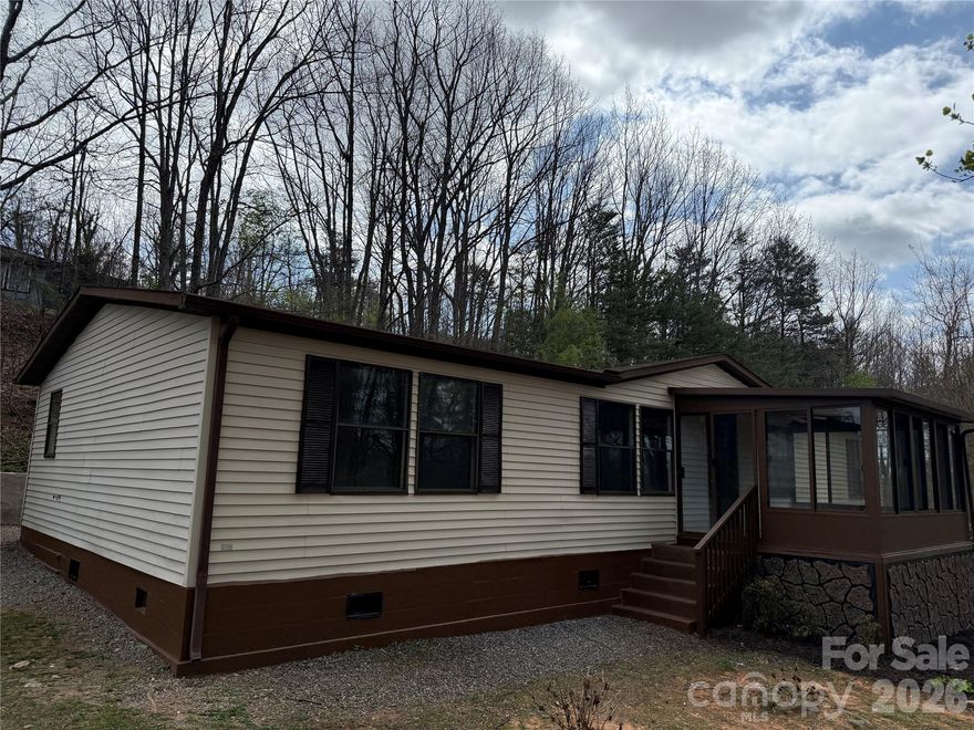 Great investment opportunity!  This property features a 3-Bedroom 2-Bath manufactured doublewide home, and a separate 2-Bedroom 1-Bath site-built home with a metal roof and full basement on a spacious 1-acre lot.  The manufactured home features a large, open-concept kitchen and living room, separate family room, and an attached sunroom.  A large deck and detached carport truly make this a great property!  The charming site-built home features a functional layout and great views.  Live in one home and use the other for additional income, or use both homes for rental income.  The choice is yours!