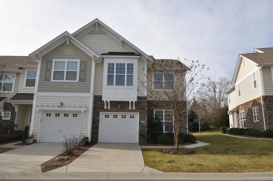 Fabulous, like new end-unit townhouse w/tons of upgrades, wonderful light & a garage!  This home shows incredibly w/beautiful hardwoods throughout the open floor plan main level w/ lovely gas fire place & dining area.  The kitchen boasts stainless appliances, breakfast bar & tons of counter space!  Extra storage built in! Upstairs features large master w/high ceilings & separate luxury bath w/tiled shower/garden tub.  Bedrooms 2 & 3 well sized w/great closets.  Screened porch ideal for relaxing.