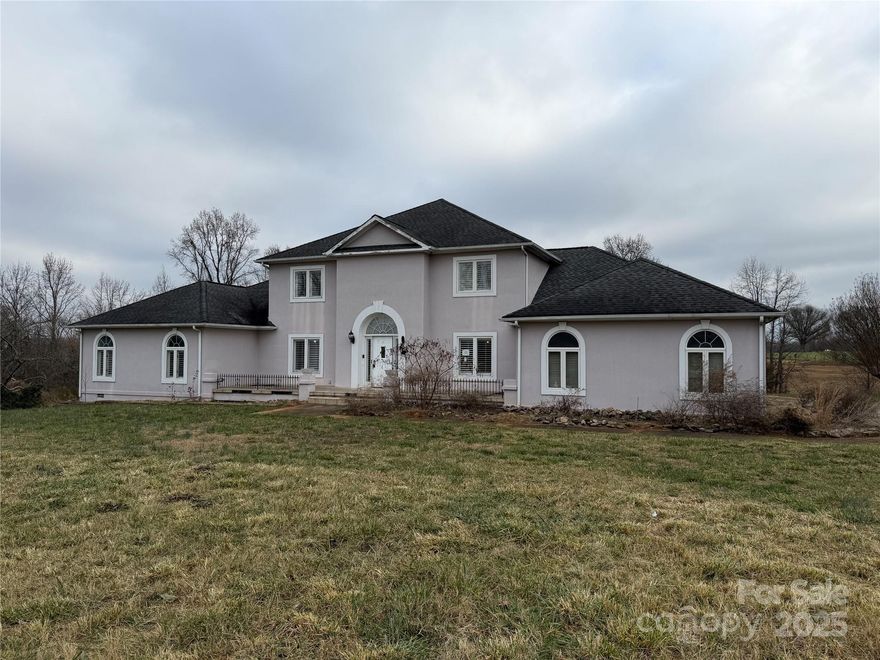 Experience refined living in this stunning 4-bedroom, 4.5-bath home in Cherryville, and offering over 4,000 square feet of beautifully designed space. Hardwood floors flow through the main living areas, creating a warm and timeless atmosphere, while the bedrooms feature plush carpeting for added comfort. The expansive layout includes multiple living and entertainment spaces, all crafted with attention to detail. Step outside to enjoy a private pool perfect for relaxing or hosting. Tucked away in a secluded setting yet conveniently close to local amenities, this home delivers the ideal blend of privacy and everyday convenience. HVAC unit for upstairs is inoperable. Survey recommended-Acreage is according to GIS. The driveway does not appear to be located on this parcel #.