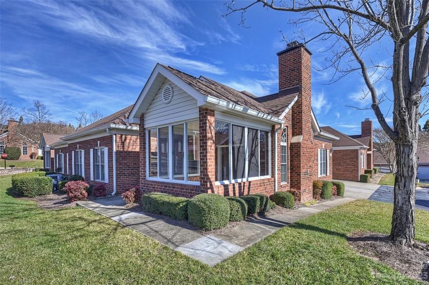 Perfect place to call home!  8445 Windsor Ridge Drive is one level living at it's finest--charming and well maintained 2 Bedroom, 2 Bath Patio Home located close to Blakeney, Stonecrest and Ballantyne Village. Most of the home has hardwood laminate flooring--Primary Bedroom has carpet and Bathrooms have tile.  The Primary Bedroom has a lovely tray ceiling, plenty of light, a walk in closet and an en suite Bath.  Great flow between the Great Room with Fireplace and the Dining Area. The Kitchen is so sharp with the black and white contrast--gas stove and spacious Pantry.  The 2 Car Garage is right off the Kitchen and it has a useful Utility Sink. The unheated Sunroom will provide  a warm sunny retreat for most of the year.   Enjoy the wonderful Pool, Fitness Center and the Club House.  HOA covers water, sewer, lawn maintenance, roof, and shutters.