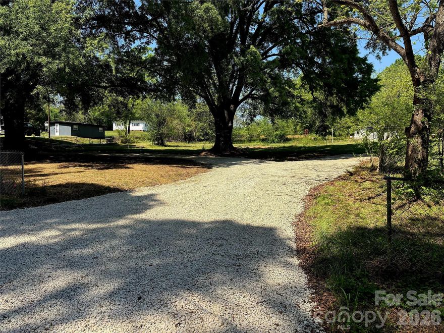 Location, location, location! If you are looking for a buildable lot, close to shops and restaurants, this is it. This three quarter acre lot is located on a quiet, paved road that dead ends at the Coddle Creek Reservoir. Shops and restaurants at the intersection of Kannapolis Parkway & Hwy 73 are within a mile. Additionally, Afton Ridge Shopping Center (consisting of super Target, and many other stores), and I-85 are only 2.5 miles away. The lot is fenced, with a new gravel horseshoe driveway. At one time, a 2 bedroom home was on it, and that septic system remains. The previous septic tank was removed and replaced with a new 1000 gallon tank and an existing use permit was issued by Cabarrus County Health Alliance. There is an existing well, but the condition is unknown. There is no HOA, no timeframe to build, and no known restrictive covenants. Barndominiums, mobile homes, and modular homes are allowed, or bring your own builder. Agent owned.