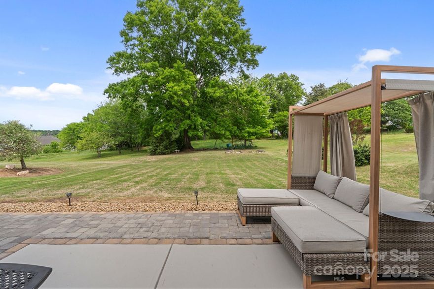 Great Home with COMMUNITY POOL @ a Great Price + a SELLER INCENTIVE of $5k towards Buyer closing costs/rate buy down. Desirable Open Floor Plan Home w/ 3 Bed 2.5 Bath plus Loft with large level lot Backing up to Mature trees! An Expansive back patio w/ both privacy & a park like serenity.  The Neighbors on both sides do not have windows facing the backyard of this home & the property located directly behind this home is owned by the HOA. Home has surround sound in the Great Room, overhead garage storage racks, & a tankless hot water heater.  Located close to I77, Lowes Corporate, the New DUKE Hospital, & in the prestigous IB SCHOOL SYSTEM.