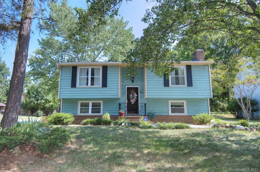 Great home on large corner lot. Split foyer w/ spacious LR/DR up with bright kitchen; S/S appliances and tile flooring.  Lots of natural light shines through sliding door leading to newer deck. Each level features 2BR's and Full BA.  Den w/ wood burning FP and built-ins dwn. Large laundry/mud room with backyard access. Mature neighborhood with beautiful trees and NO HOA. Easy access to center city and minutes to the University area. Two driveways offers lots of parking. Property being sold AS IS